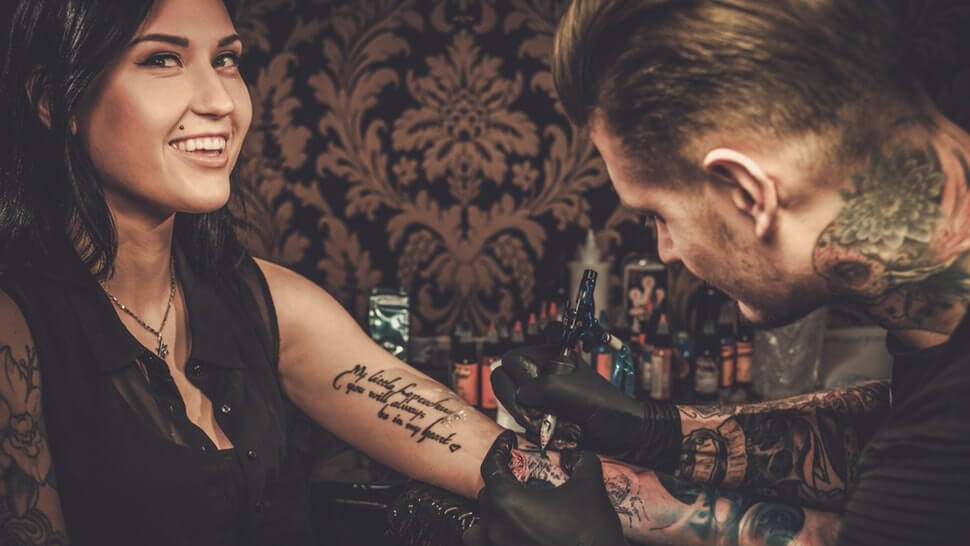 getting a tattoo with numbing cream